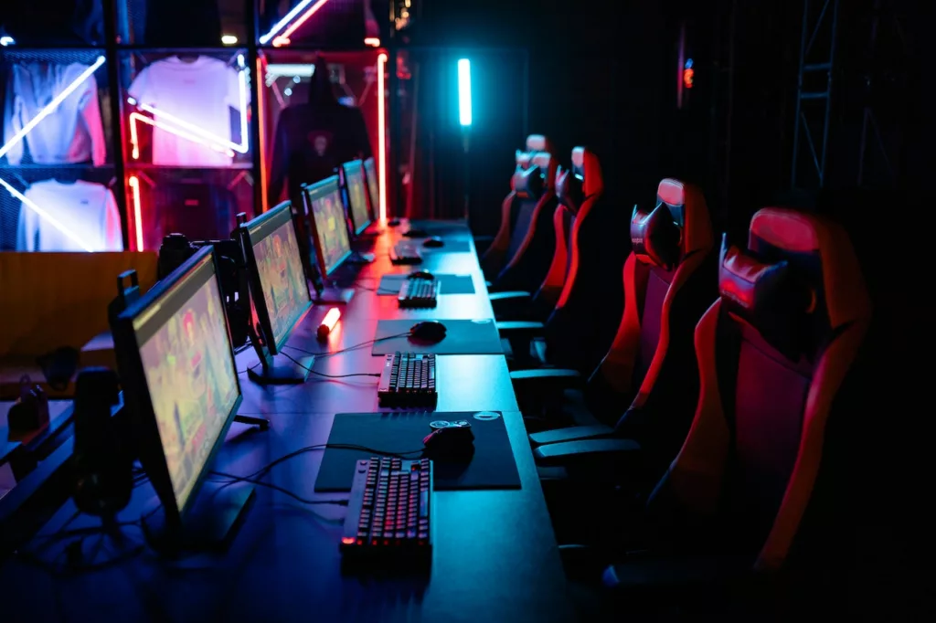 empty gaming room with chairs and computers